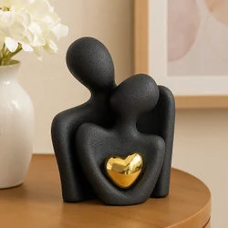 Ceramic couple figurine with golden heart black