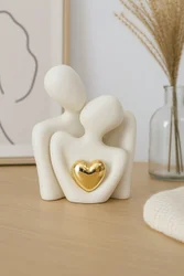 Ceramic couple figurine with golden heart